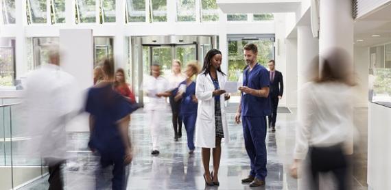 Doctor talking to a patient in the lobby of a Dutch hospital